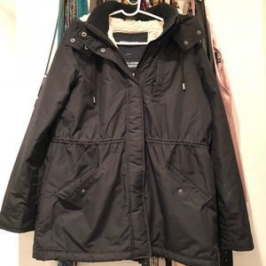 Black fleece-lined waterproof coat